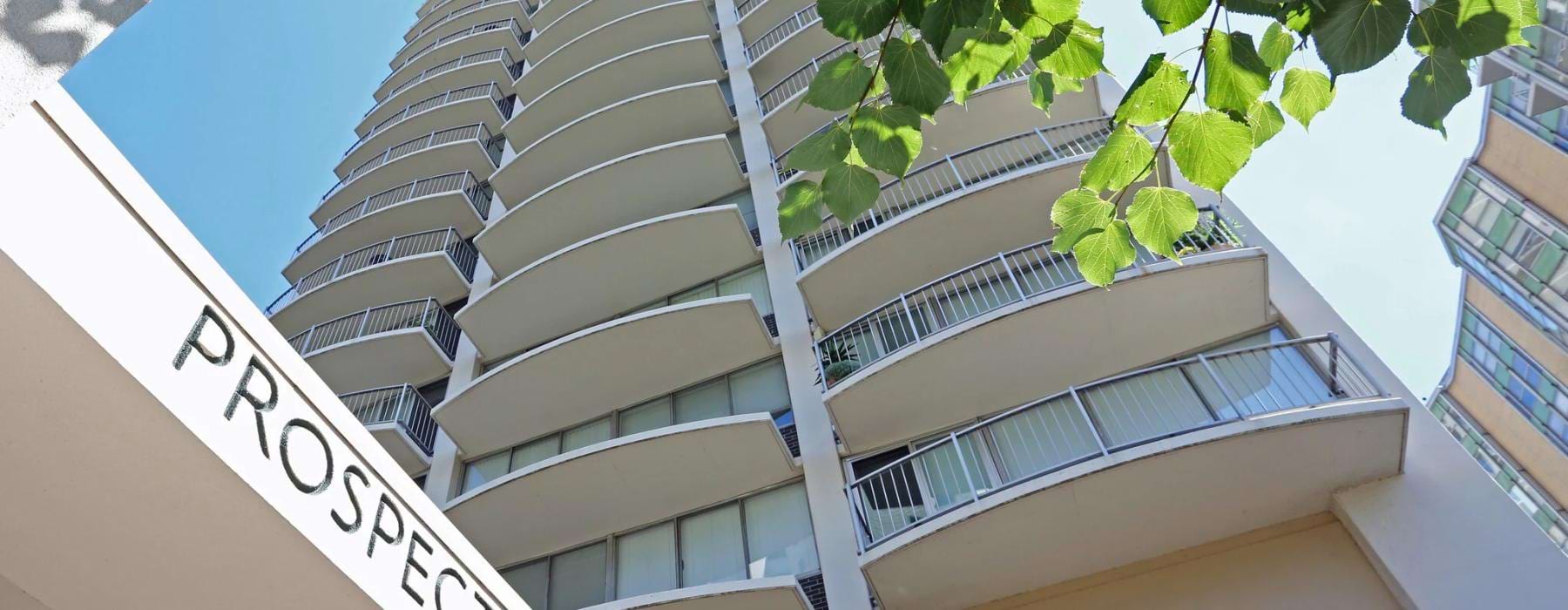 a building with a tree in front of it
