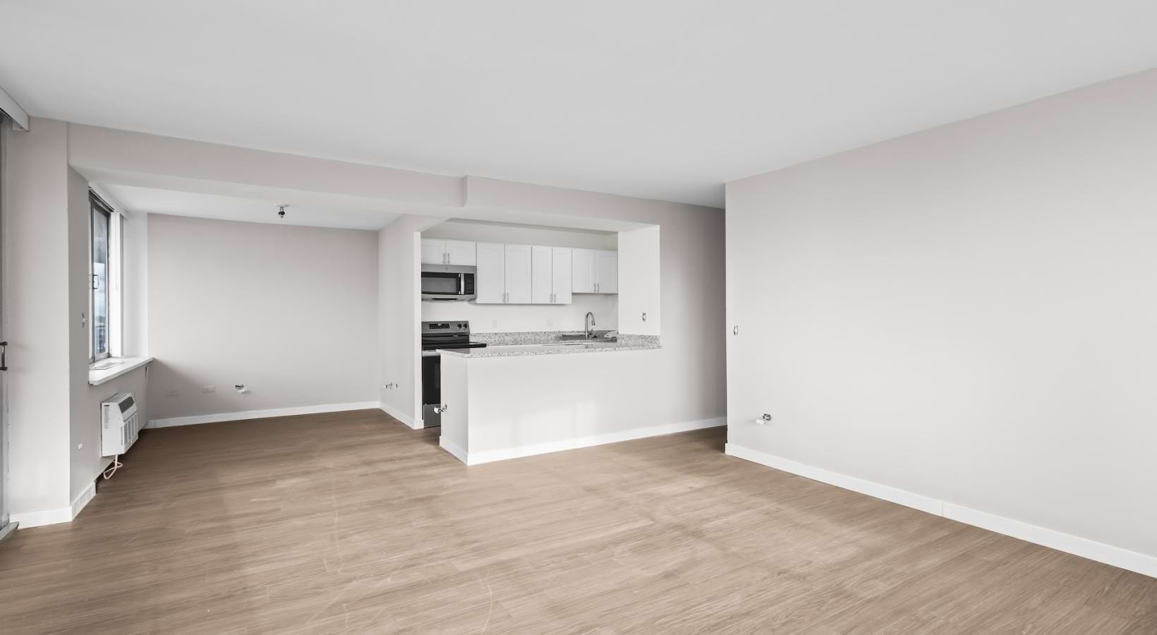 a kitchen with white cabinets